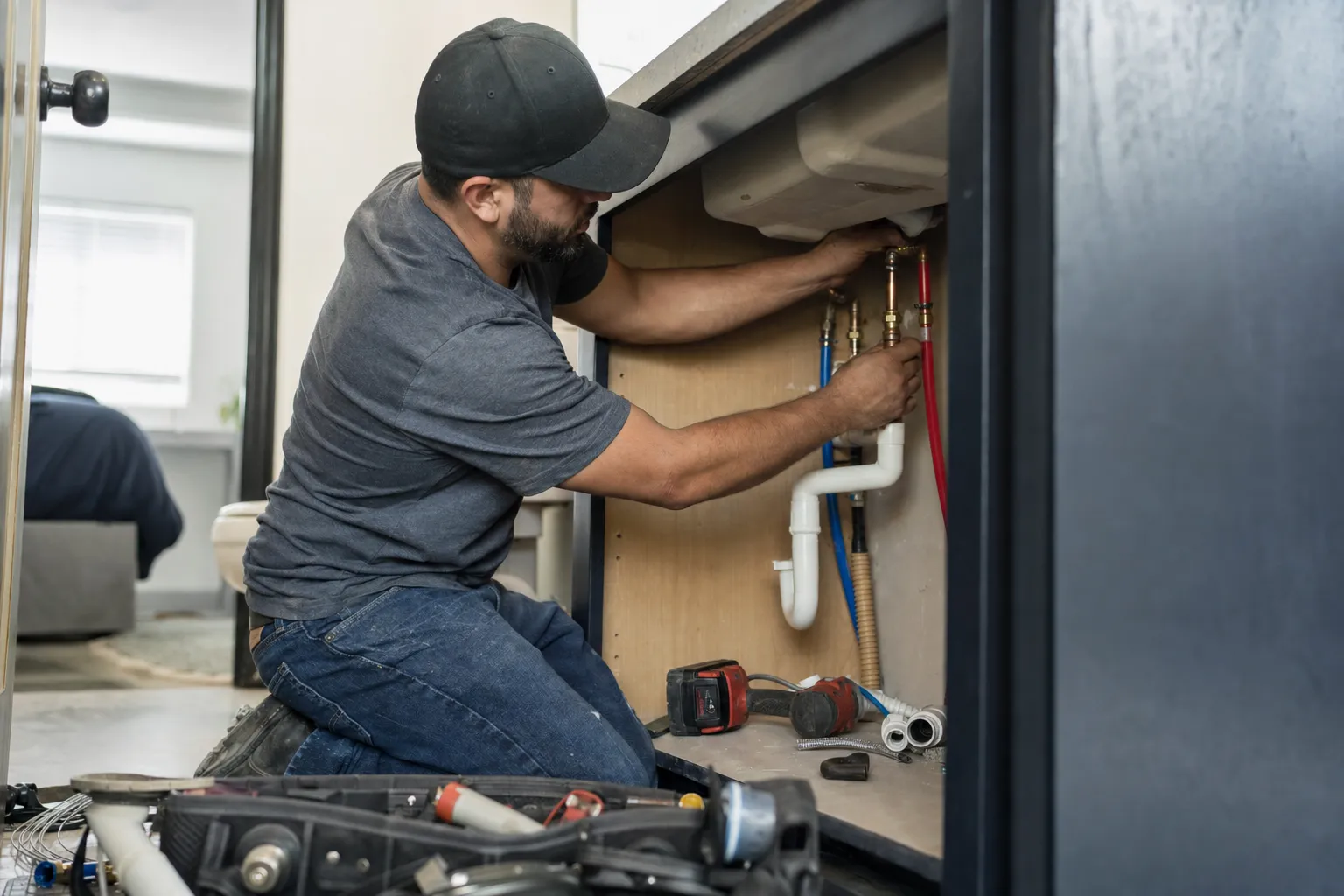 A plumber at work on a job site